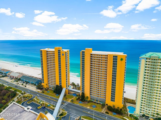 aerial view featuring a view of the beach and a water view