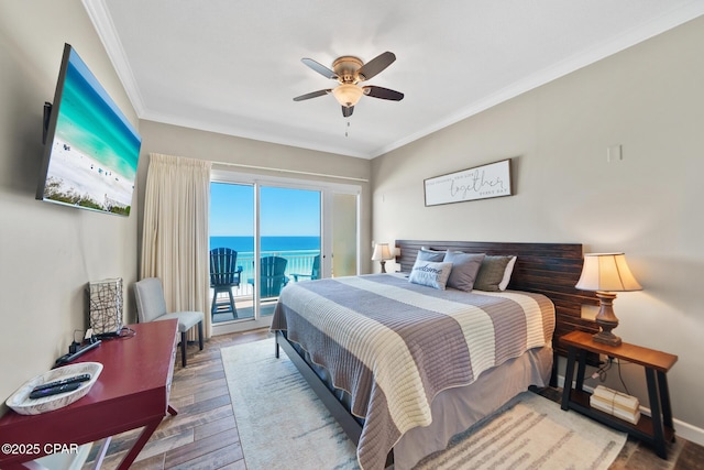 bedroom with ceiling fan, wood finished floors, baseboards, access to outside, and crown molding