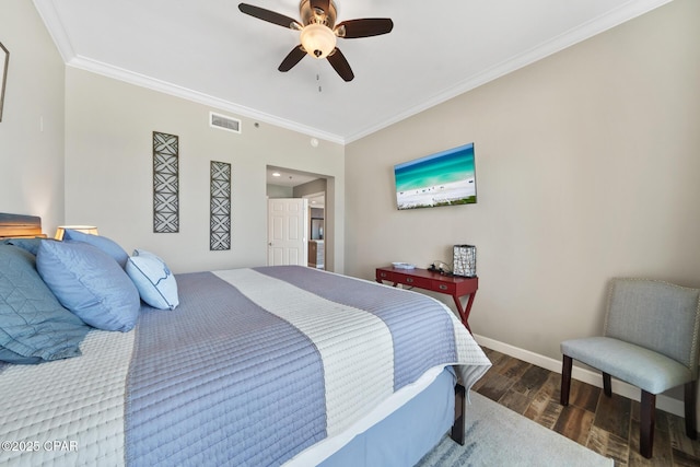 bedroom with ceiling fan, dark wood-style flooring, visible vents, baseboards, and crown molding