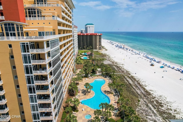 drone / aerial view with a water view and a view of the beach