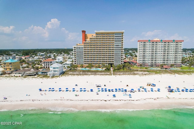 birds eye view of property with a city view, a beach view, and a water view