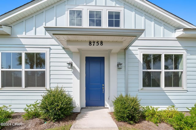 doorway to property with board and batten siding