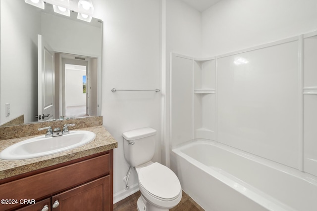 full bathroom with shower / washtub combination, vanity, and toilet