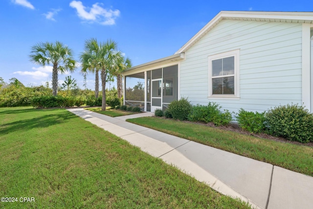 view of yard featuring a sunroom