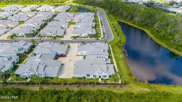 bird's eye view with a water view and a residential view