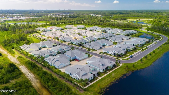 drone / aerial view with a residential view and a water view