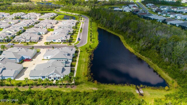 drone / aerial view with a water view and a residential view