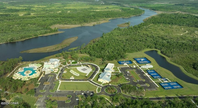 aerial view with a water view and a forest view