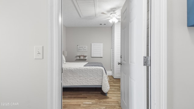 bedroom with wood finished floors and visible vents