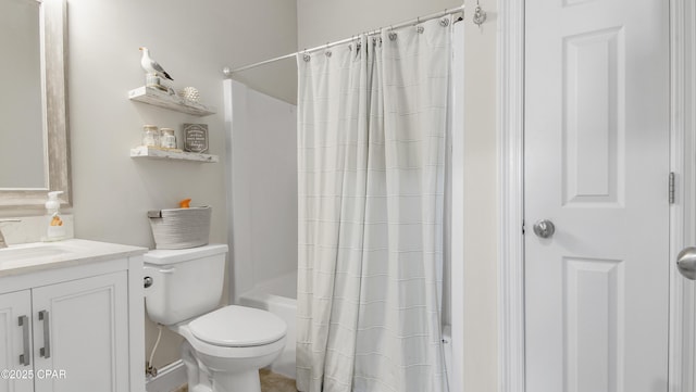 bathroom featuring shower / bath combo, vanity, and toilet