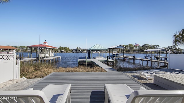 dock area with a water view and boat lift