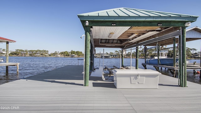 dock area with a water view and boat lift