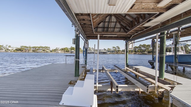 view of dock with a water view and boat lift