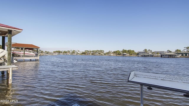 view of dock featuring a water view and boat lift