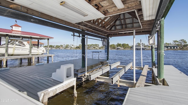 view of dock featuring a water view and boat lift