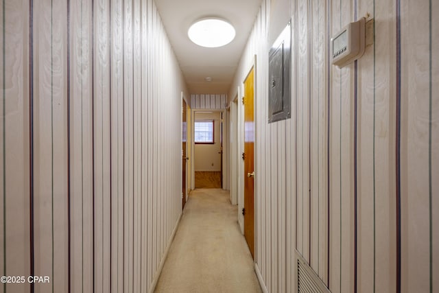 corridor featuring light colored carpet