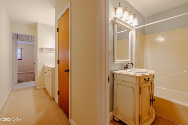 bathroom featuring vanity and baseboards