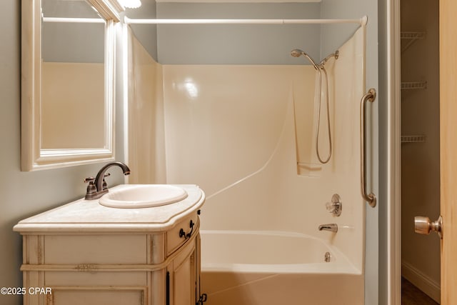 bathroom with vanity and bathing tub / shower combination