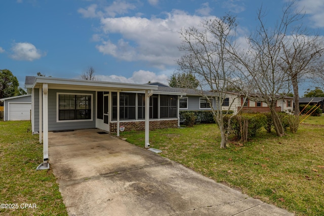 view of front of home with a front yard and a sunroom