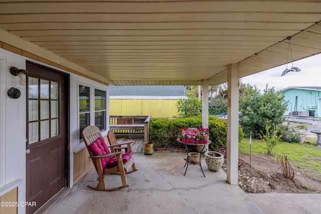 view of patio featuring fence