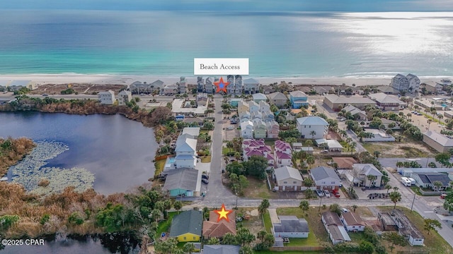 bird's eye view with a water view, a residential view, and a beach view