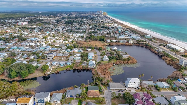 birds eye view of property with a water view and a residential view