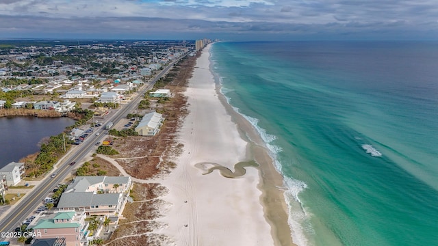 aerial view with a water view and a view of the beach