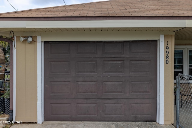 garage featuring fence