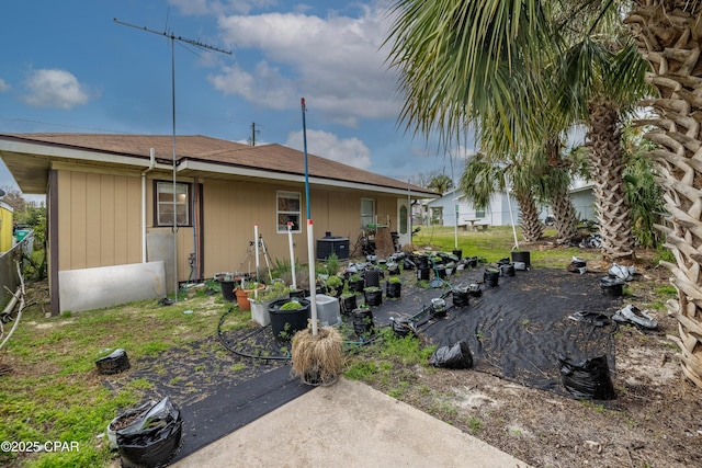 back of house with a patio area and fence