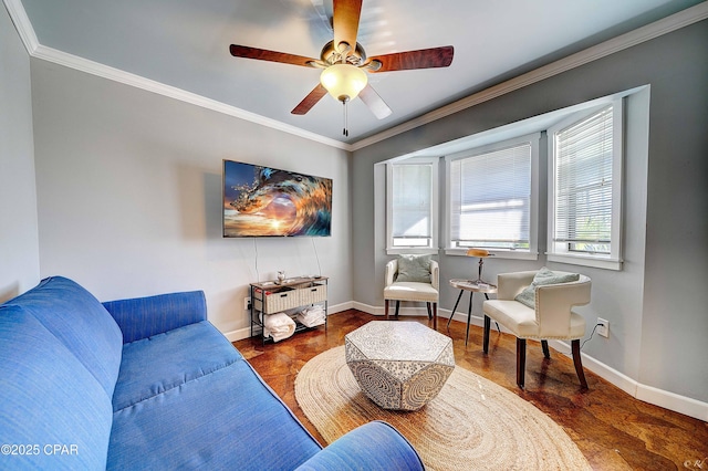 living room with baseboards, ornamental molding, and ceiling fan