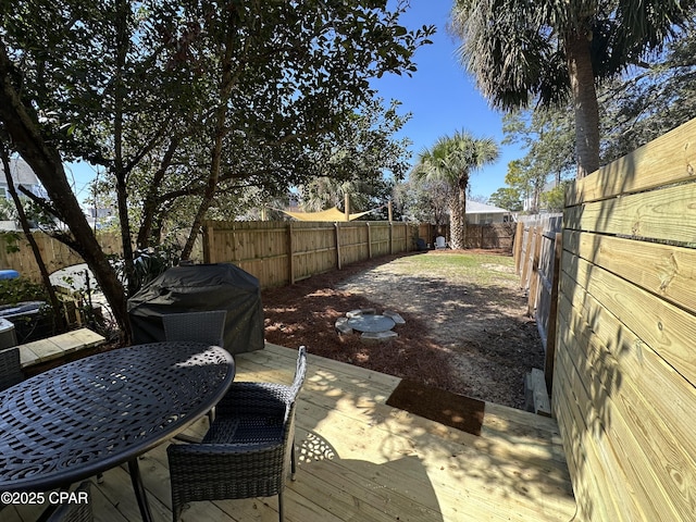 exterior space with a fenced backyard and outdoor dining space