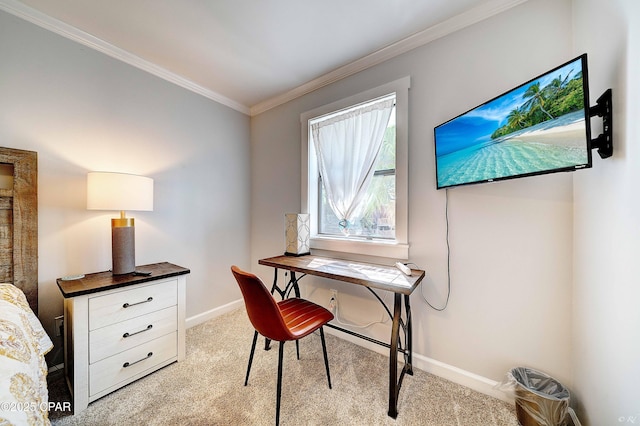 office area with baseboards, crown molding, and light colored carpet