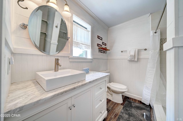 full bath featuring toilet, a shower with shower curtain, wood finished floors, and vanity