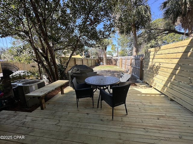 wooden deck featuring a fenced backyard