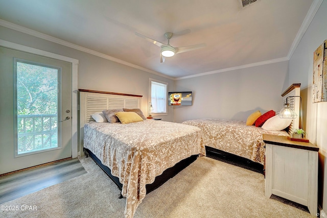 bedroom with a ceiling fan and crown molding