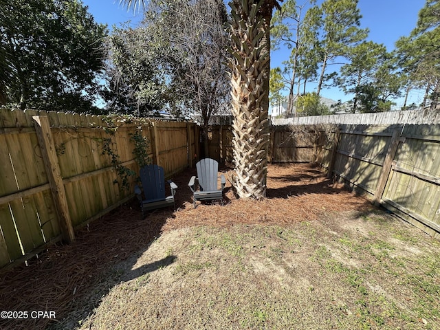 view of yard with a fenced backyard