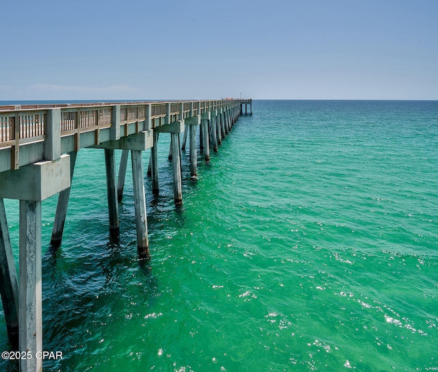 view of dock featuring a pier and a water view