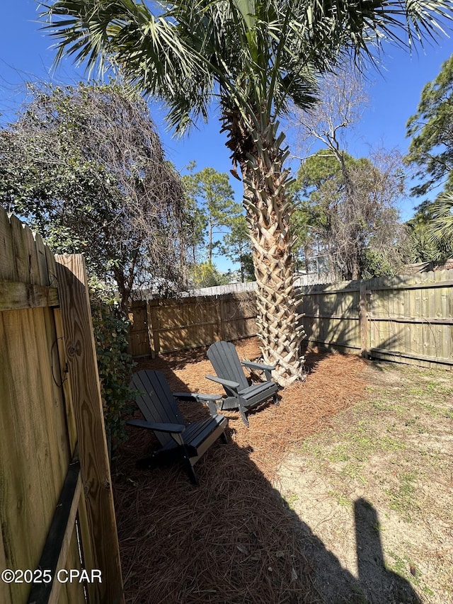 view of yard with a fenced backyard