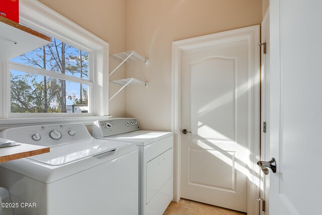 washroom featuring laundry area and washer and clothes dryer