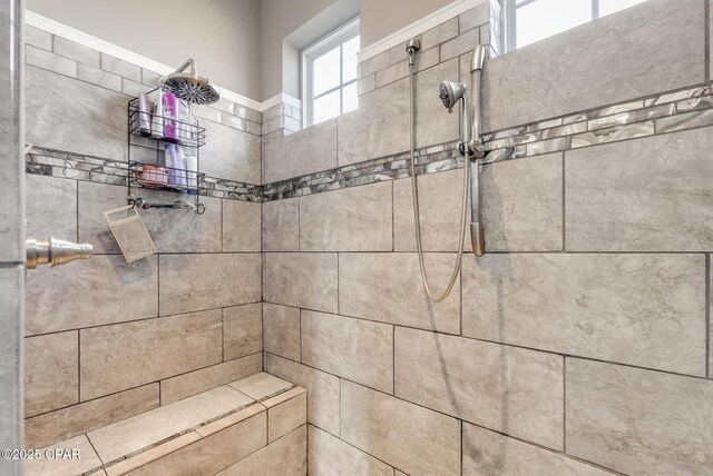 interior details with a tile shower