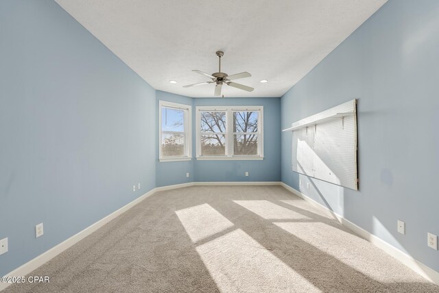 unfurnished room featuring ceiling fan, carpet floors, recessed lighting, and baseboards