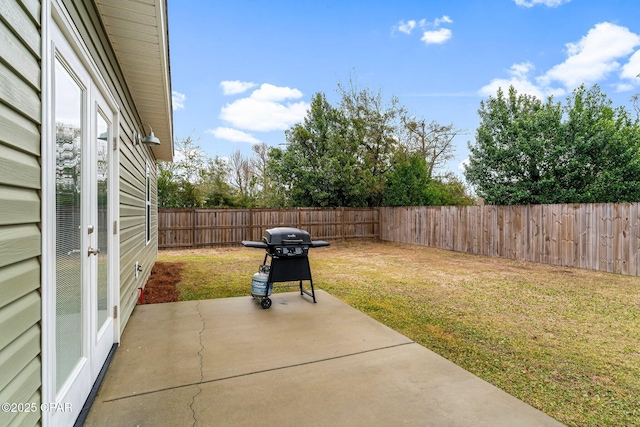 view of patio with a fenced backyard and grilling area