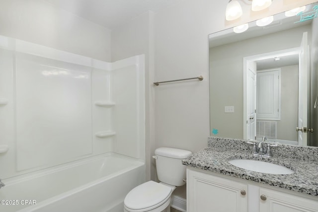 full bathroom with bathing tub / shower combination, vanity, and toilet