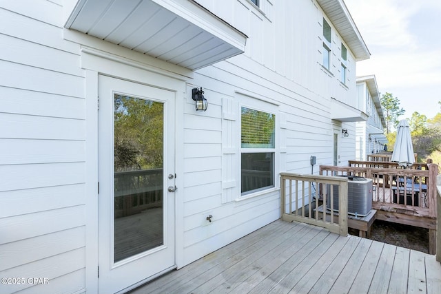 wooden terrace featuring central air condition unit