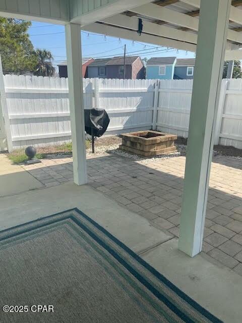 view of patio featuring fence and grilling area