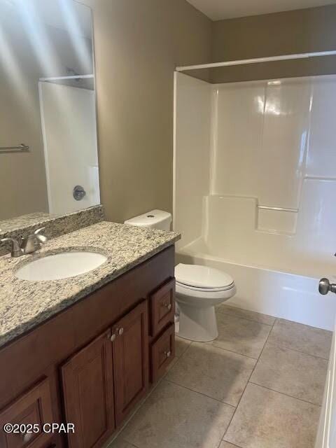 full bath featuring vanity, shower / bath combination, tile patterned flooring, and toilet