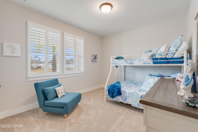 carpeted bedroom with baseboards