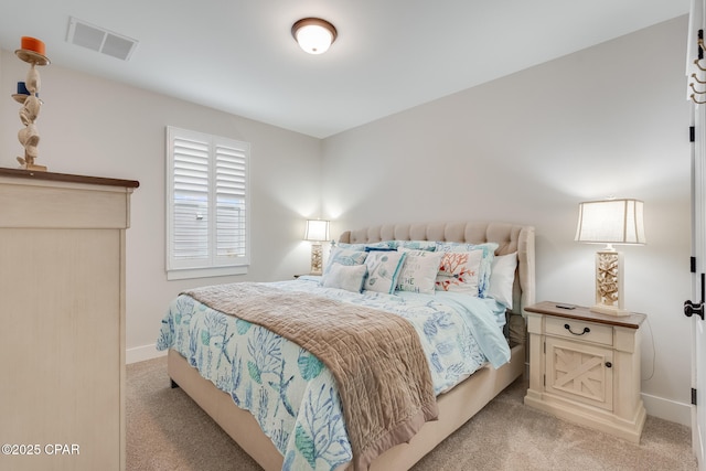 bedroom with light colored carpet, visible vents, and baseboards