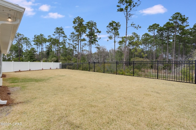 view of yard with a fenced backyard