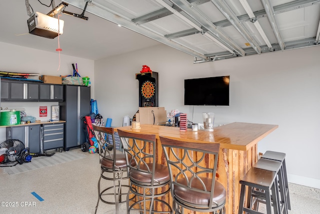 bar with light speckled floor and a dry bar